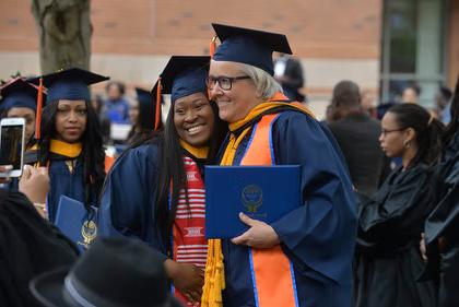 Student and professor at graduation